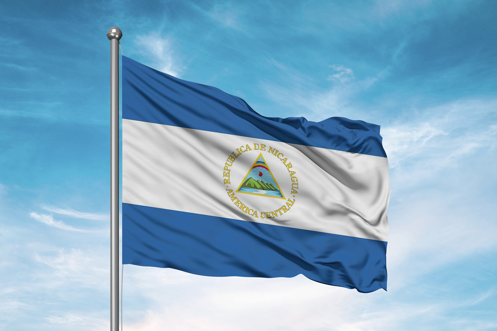 Nicaragua,National,Flag,Cloth,Fabric,Waving,On,Beautiful,Sky.