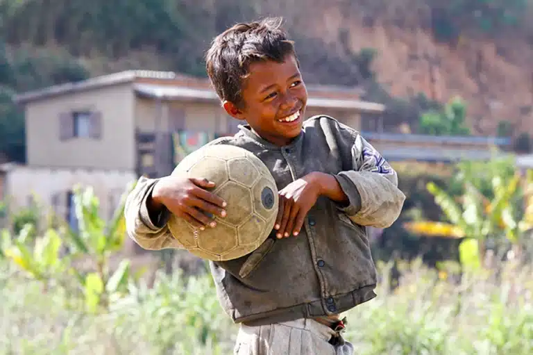 Poverty - Malagasy Boy Hand Holding Soccer Ball