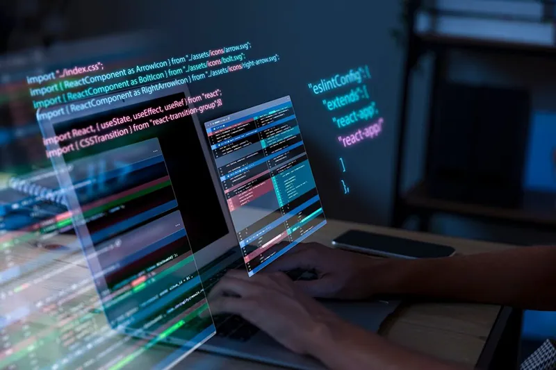 A digital overlay of computer codes with hands on a keyboard taking a coding test, symbolizing how to assess a developer's technical skills.