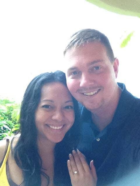 Brian Samson and his wife Christie smile for the camera as Christie shows off her new engagment ring.