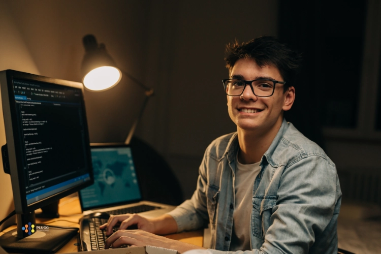 A nearshore AI Engineer working at his desk